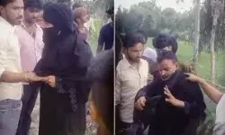 बुर्के में जा रही महिला का चेहरा देखते ही होने लगी लात घूसों की बौछार बुर्के में जा रही महिला का चेहरा देखते ही होने लगी लात घूसों की बौछार