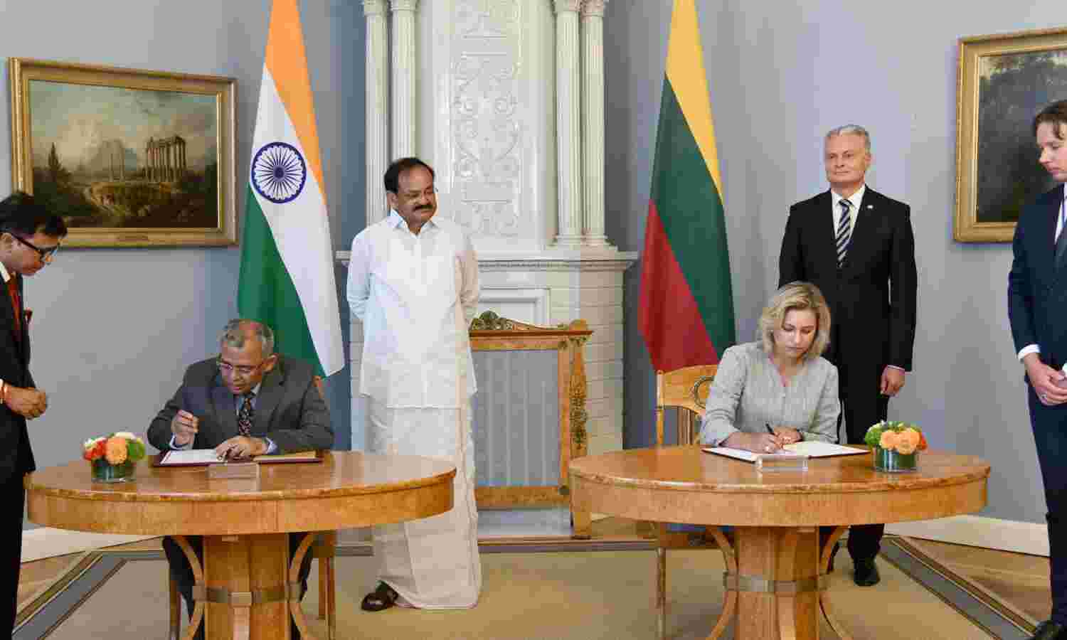 The Vice President,  M. Venkaiah Naidu and the President of the Republic of Lithuania,  Gitanas Nauseda witnessing the signing of agreements between India and Lithuania for cooperation in the fields of agriculture, legal affairs and cultural exchange, at the Presidential Palace, in Vilnius, Lithuania